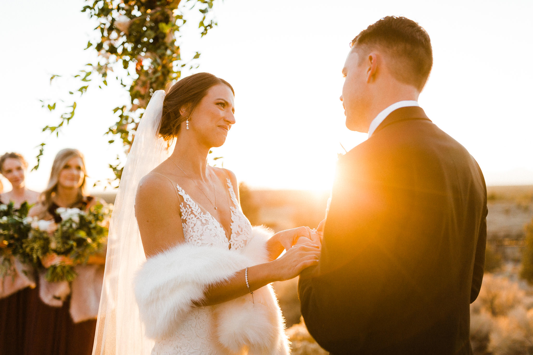 Bride is awash in golden sunset light during wedding at Brasada Ranch in Oregon