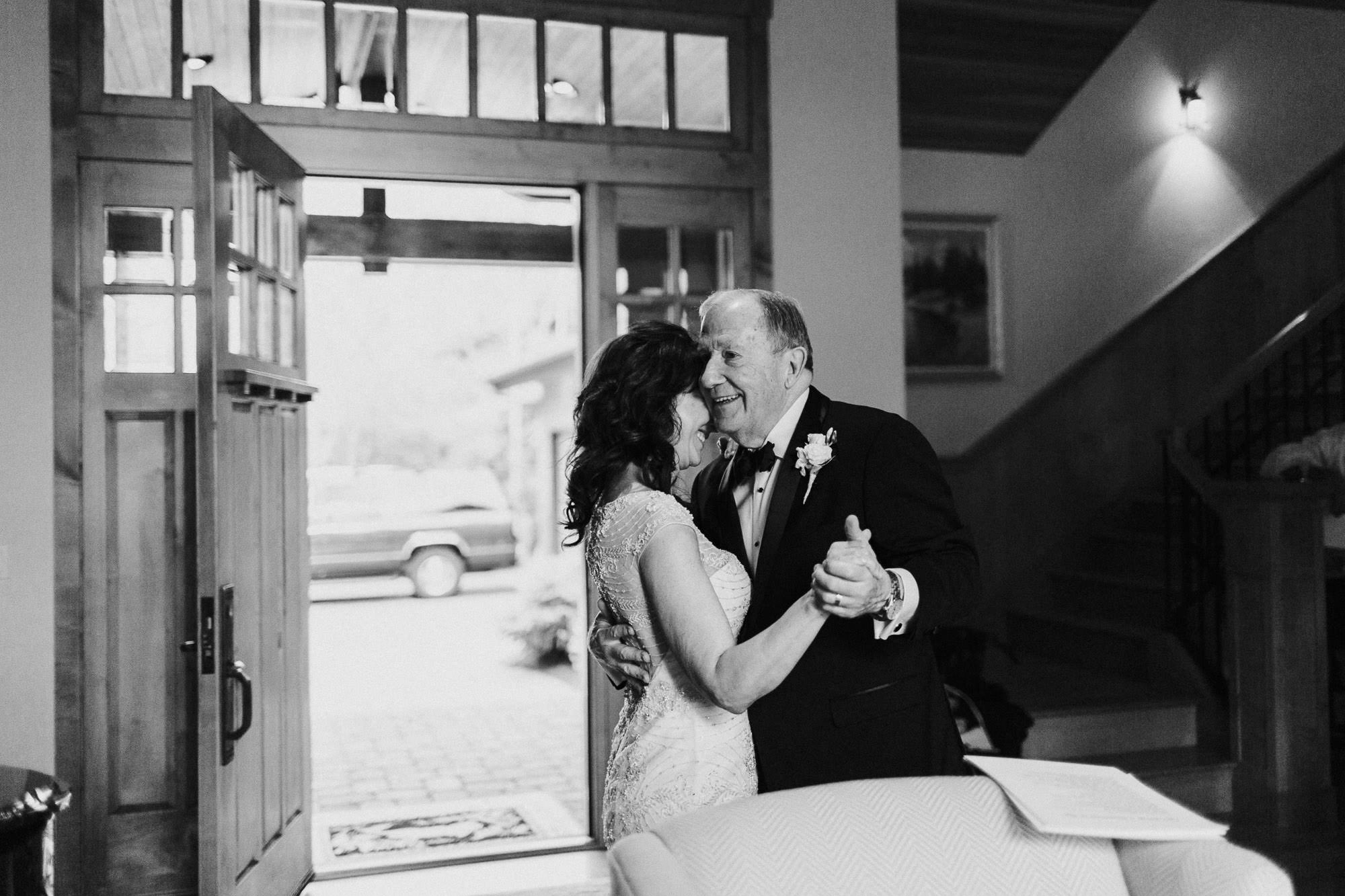 Bride and groom dance in their home in Bend, Oregon