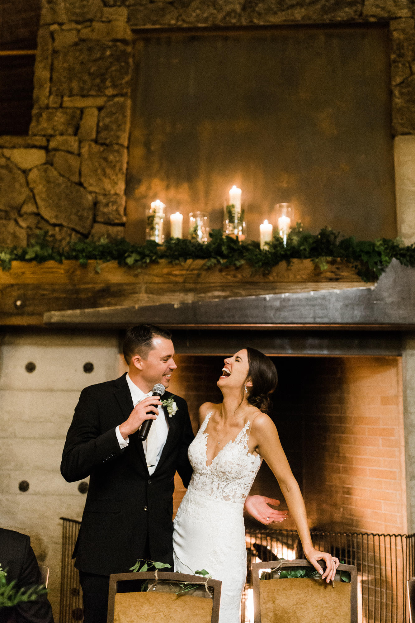 Bride laughs as groom gives speech at Brasada Ranch in Bend, Oregon