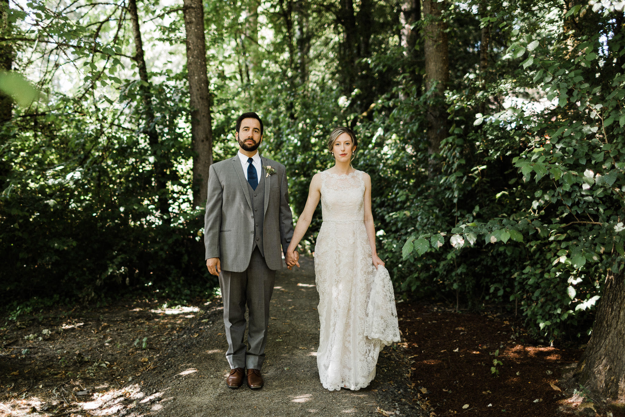 Bride and groom hold hands at Nordia House in Portland, Oregon