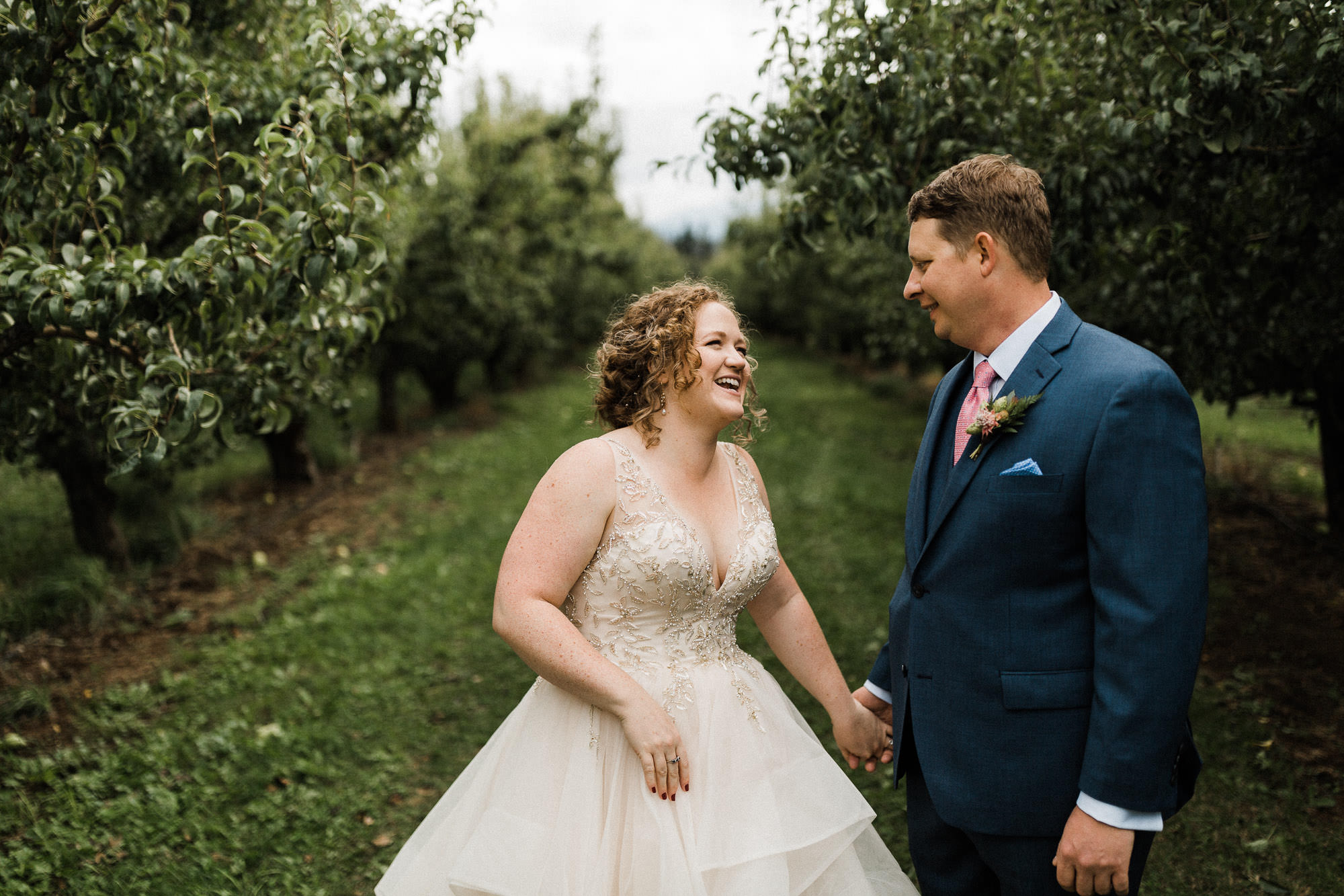 Bride and groom laugh at Mt View Orchards in Hood River, Oregon