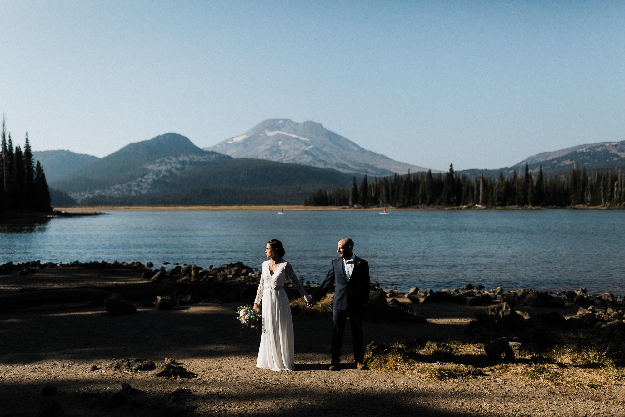 Couple hold hands at Sparks Lake, Oregon