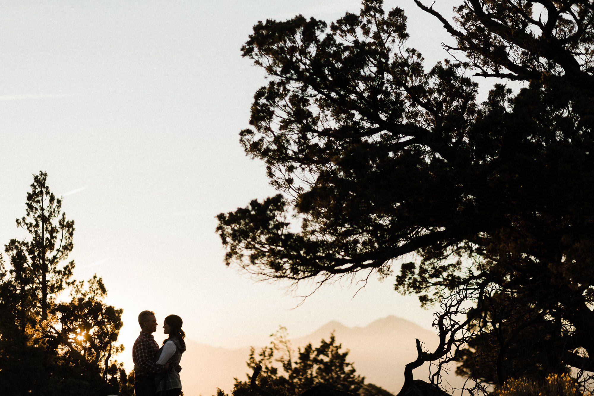 A couple is silhouetted against a mountain backdrop in Redmond, Oregon