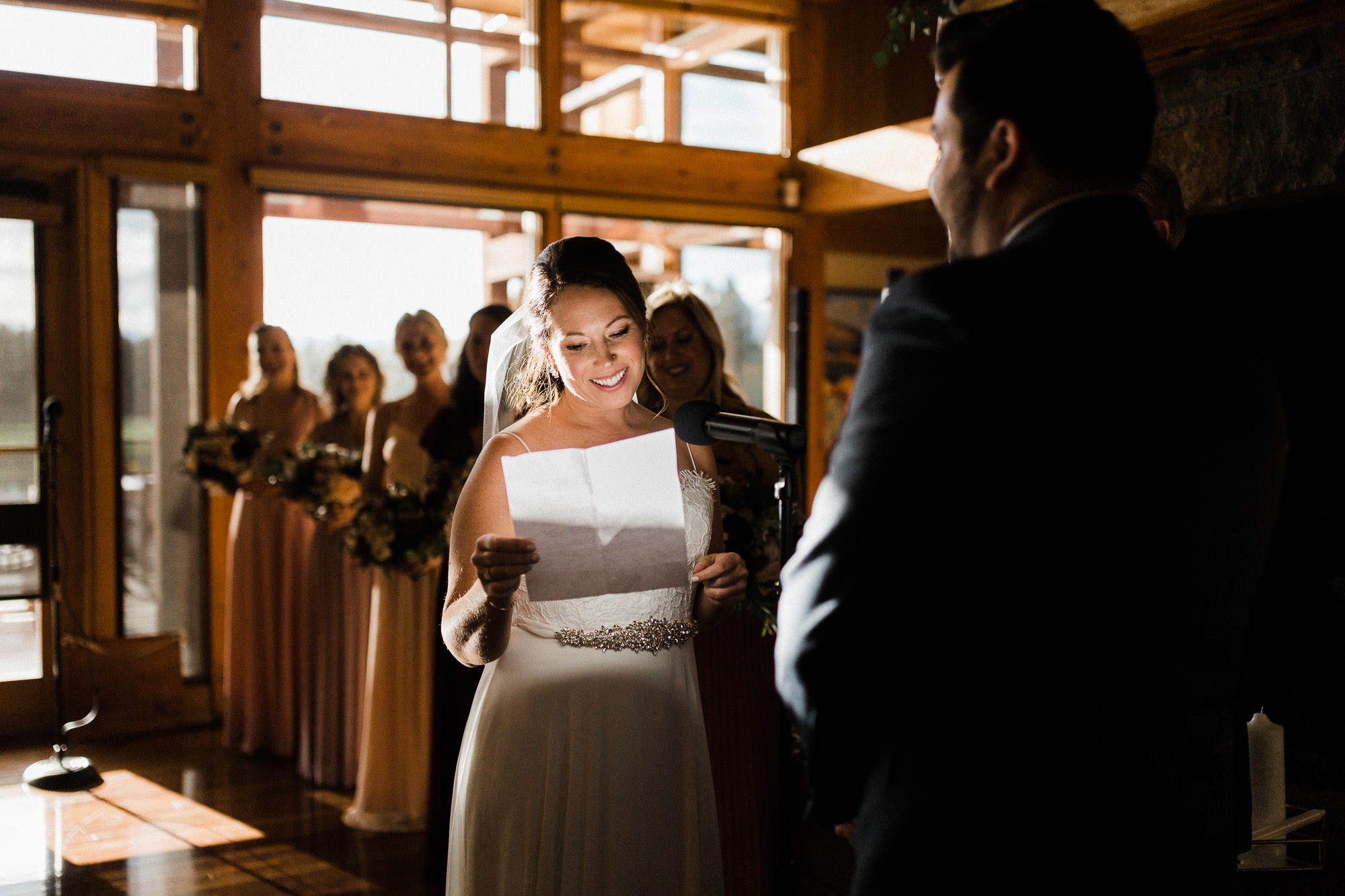 Bride reads vows during wedding at Broken Top Club in Bend, Oregon