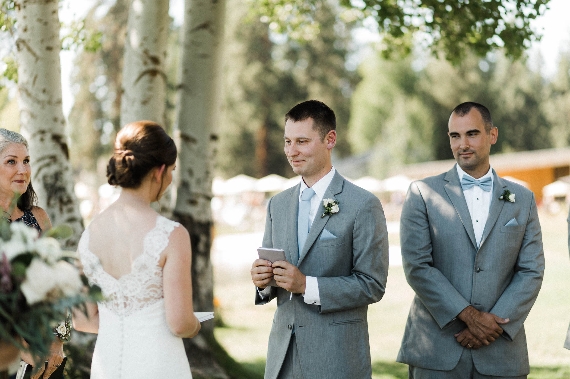 Groom finishes reading his vows during wedding ceremony at Black Butte Ranch