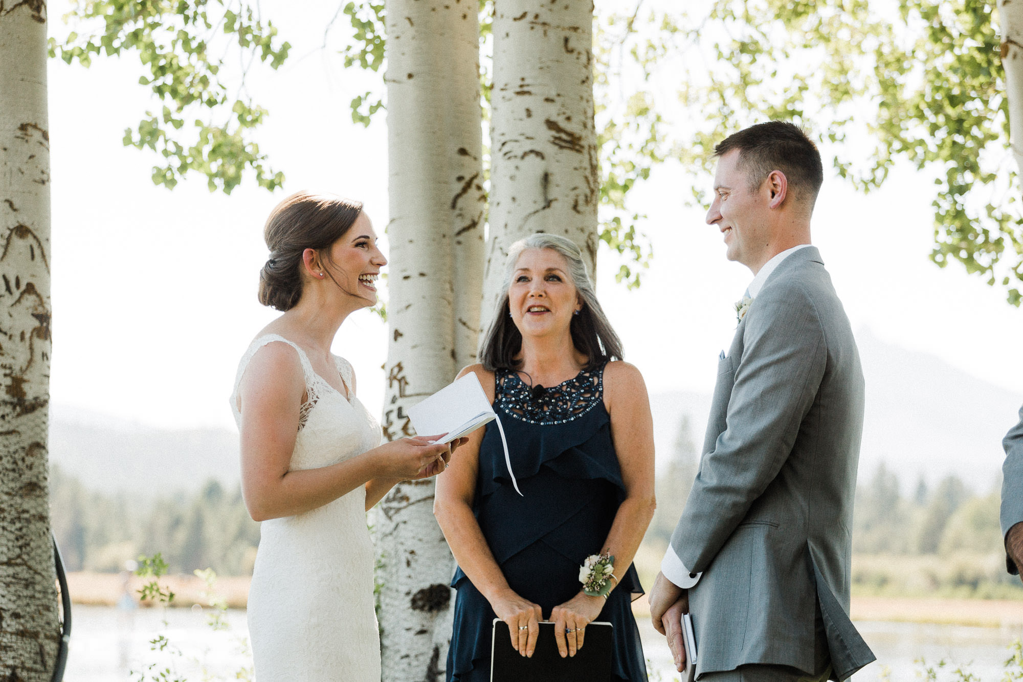 Bride reads vows during wedding ceremony at Black Butte Ranch in Oregon