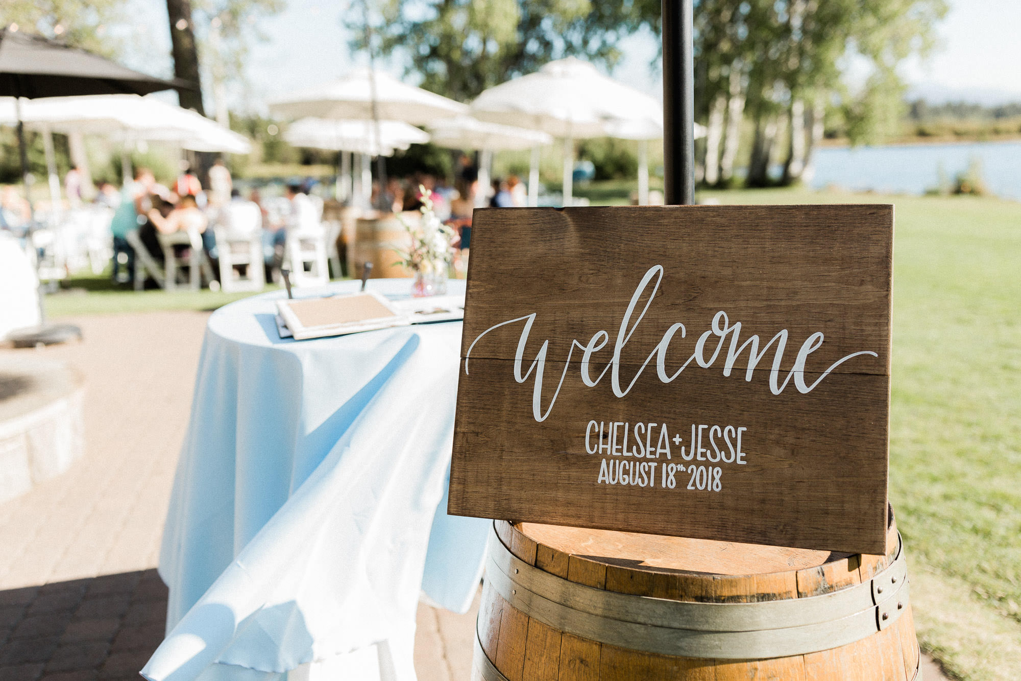 A sign reads "welcome: Chelsea + Jesse, August 18th, 2018" at Black Butte Ranch