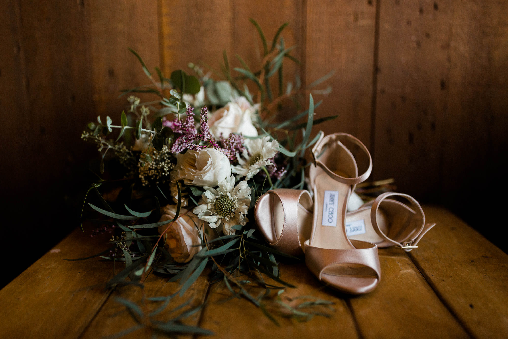 Bride's shoes and bouquet sit on a table at Black Butte Ranch in Central Oregon
