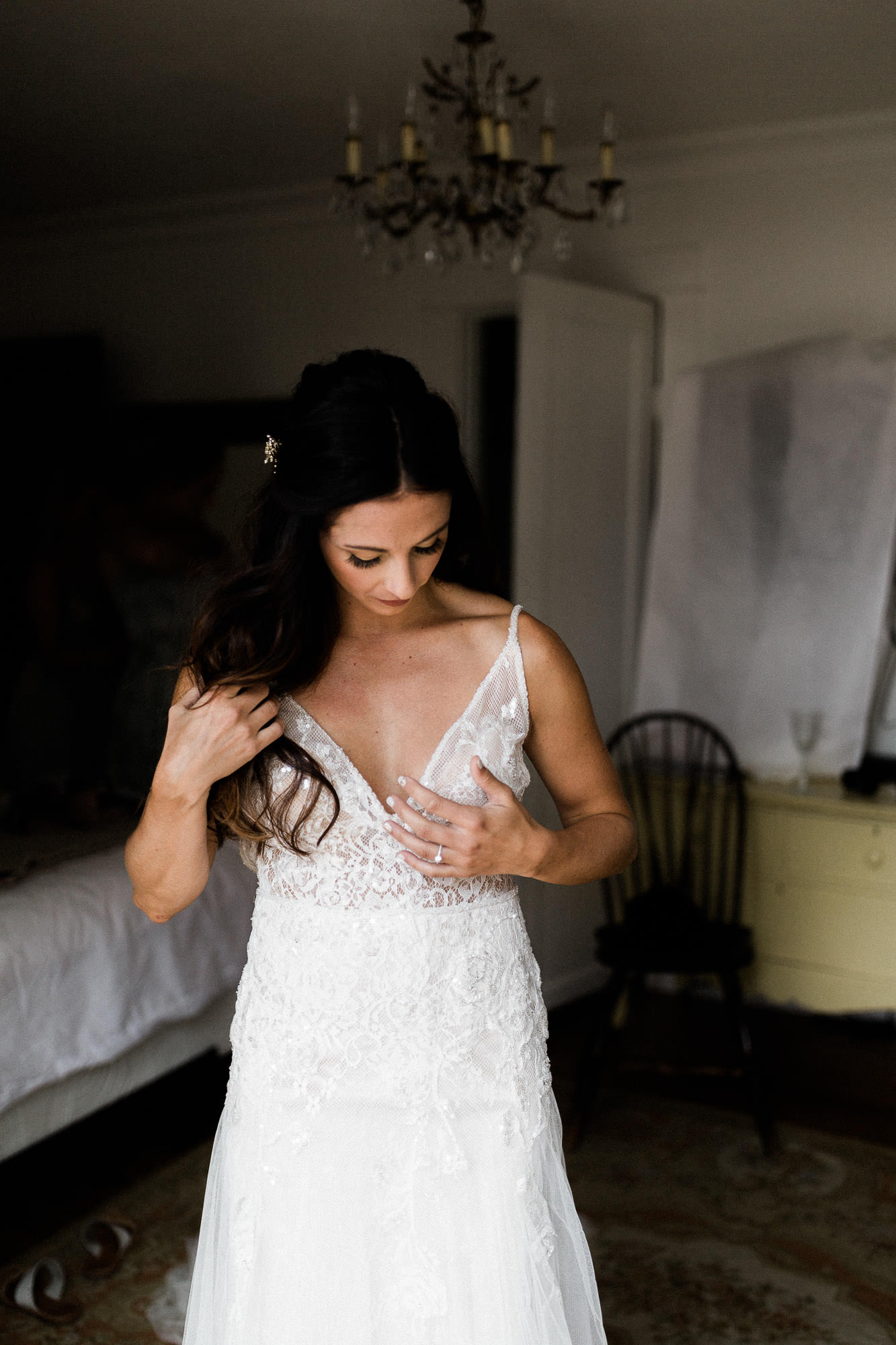 Bride puts on her dress in a cottage in Bend, Oregon
