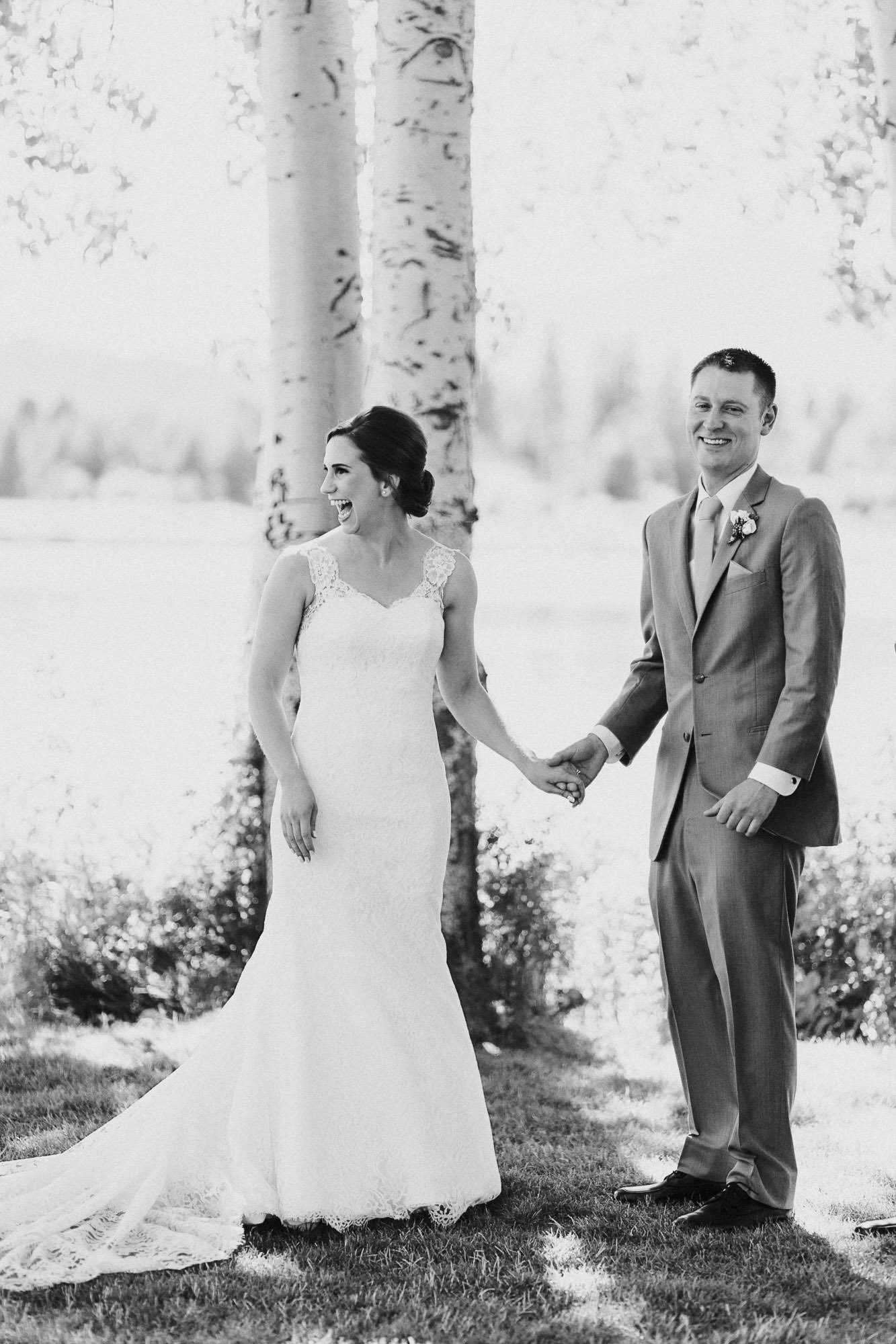 Bride and groom laugh during wedding ceremony at Black Butte Ranch