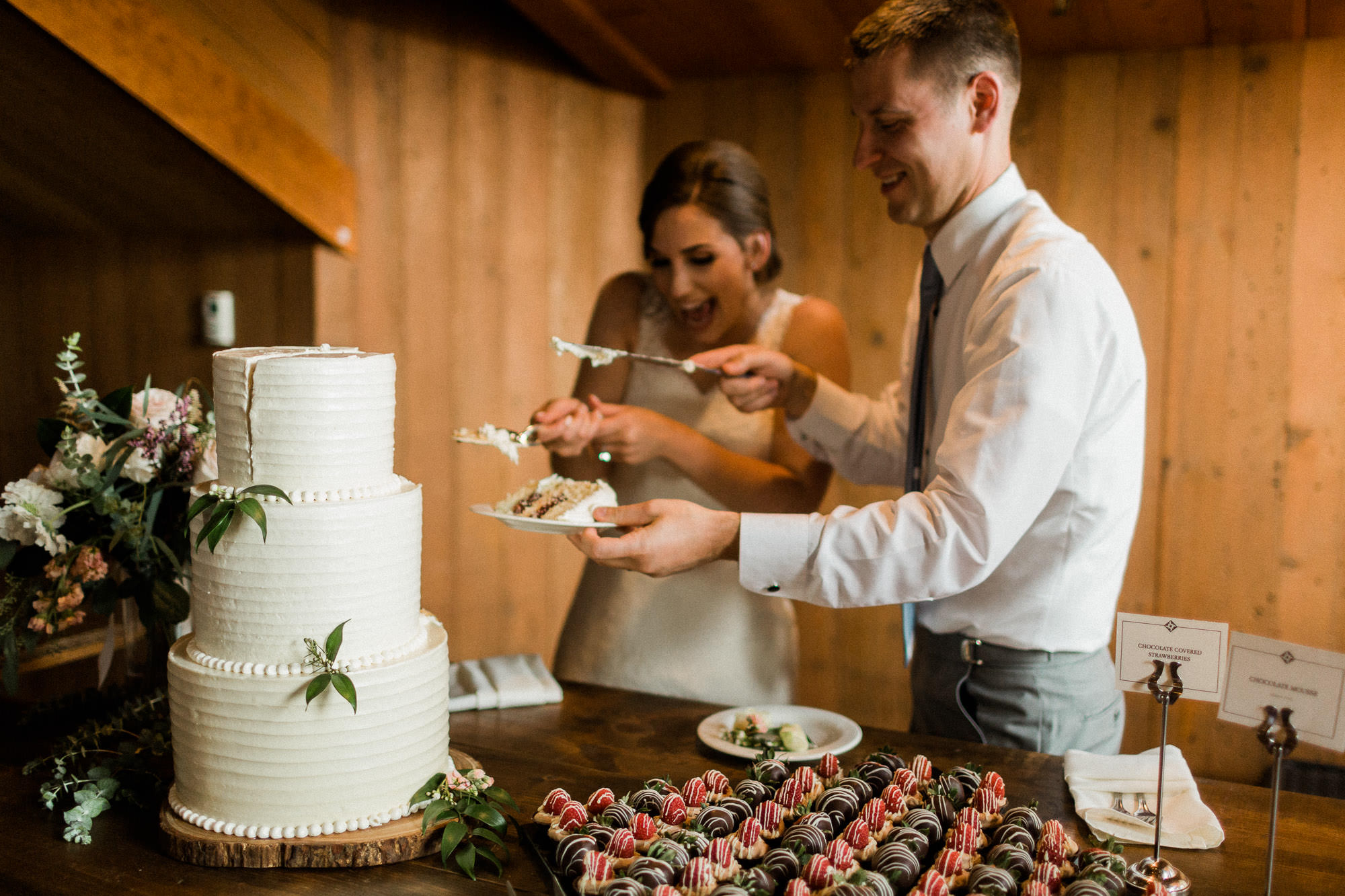 Bride and groom cut their cake at Black Butte Ranch in Central Oregon 