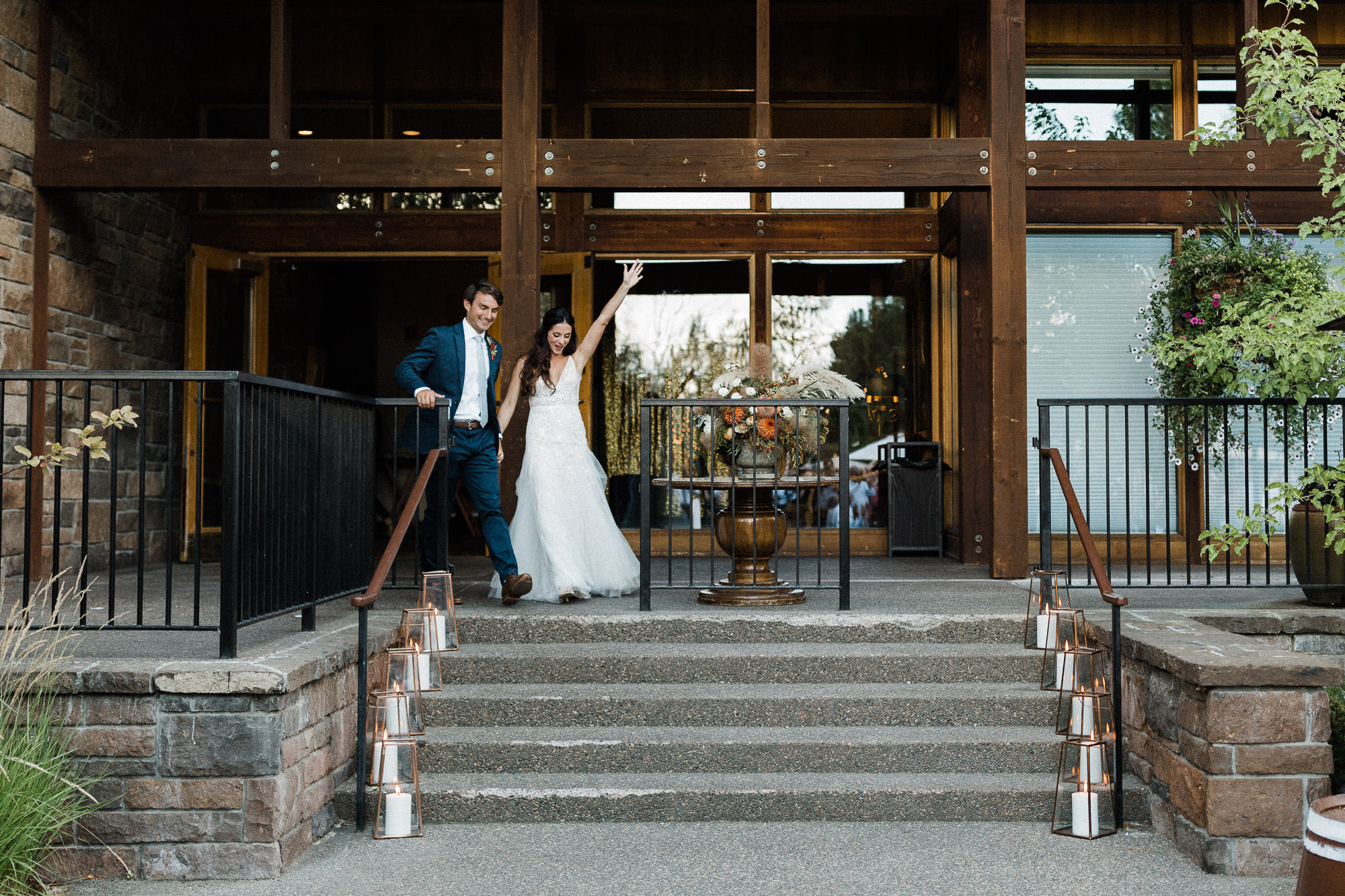 Bride and groom make grand entrance to reception at Broken Top Club in Bend, Oregon