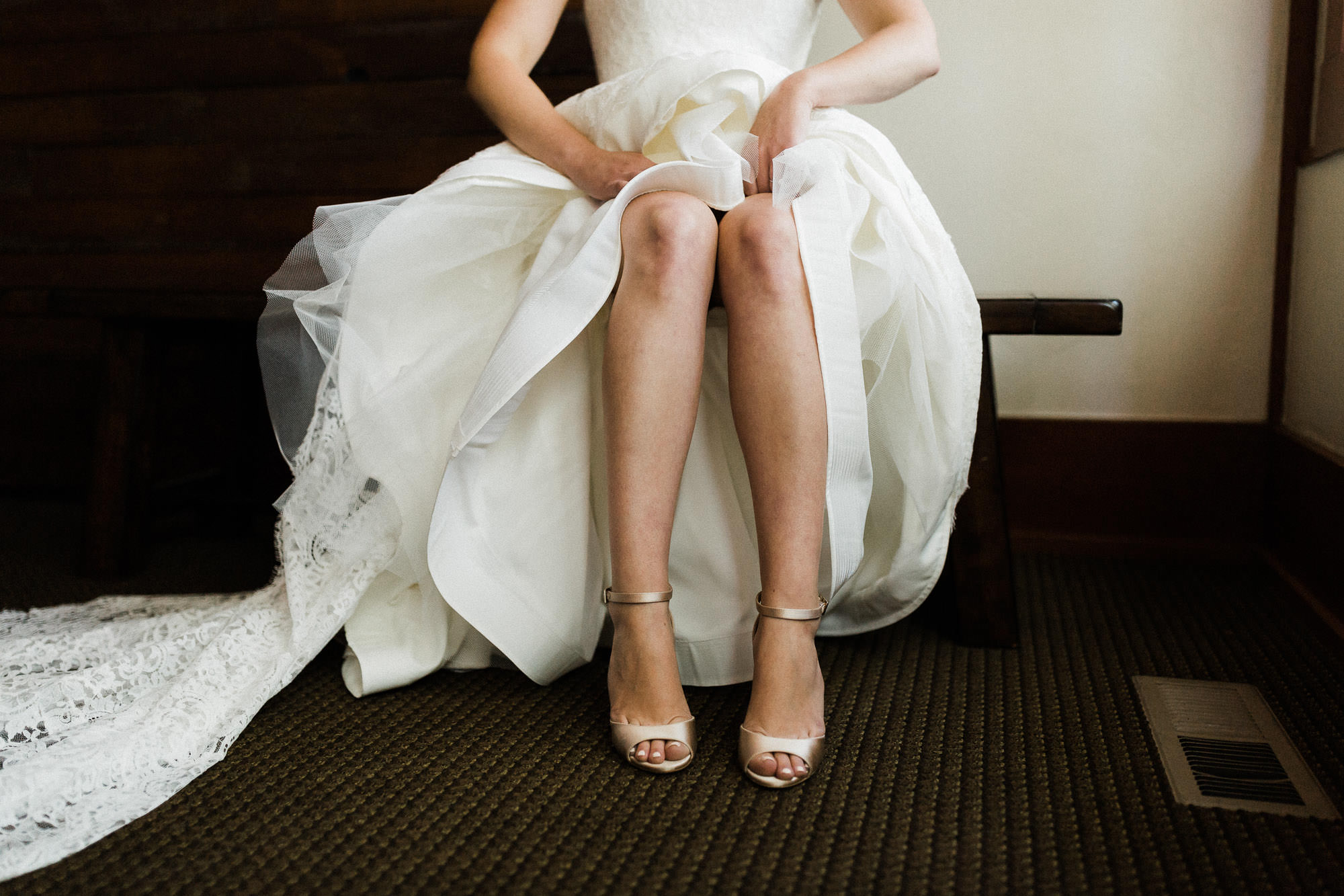 Bride puts her shoes on at Black Butte Ranch in Central Oregon