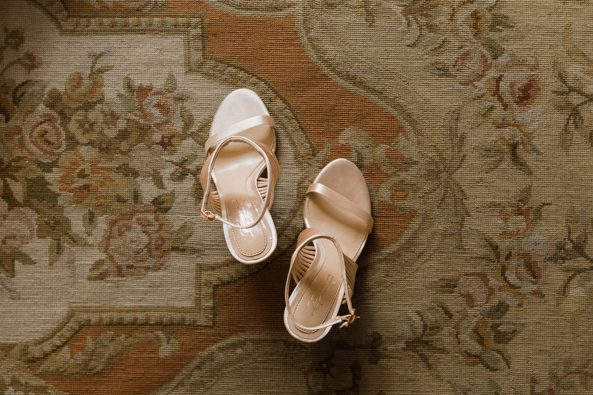 Top-down view of bride's shoes on a vintage rug in Bend, Oregon