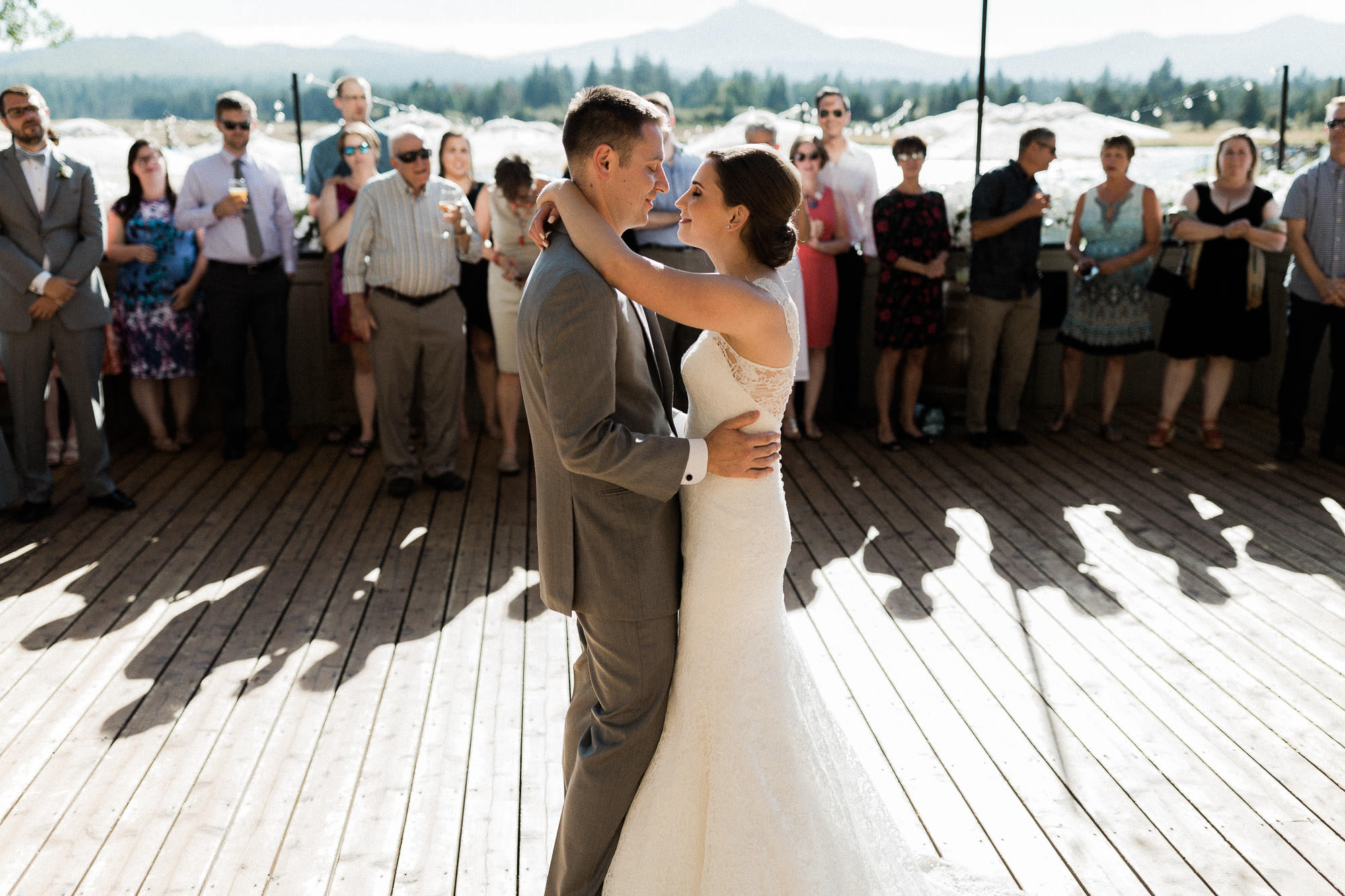 Bride and groom share their first dance on the deck at Black Butte Ranch 