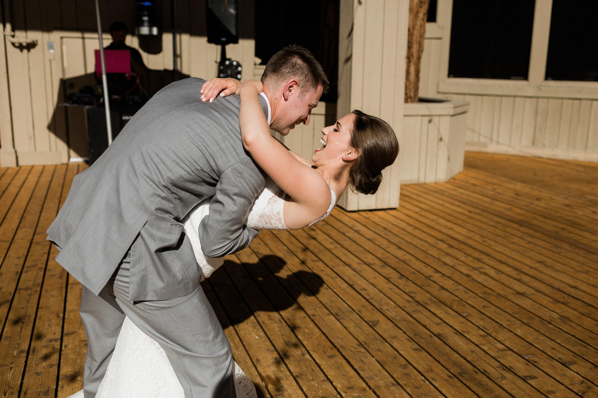 Groom dips bride during their first dance at Black Butte Ranch in Oregon
