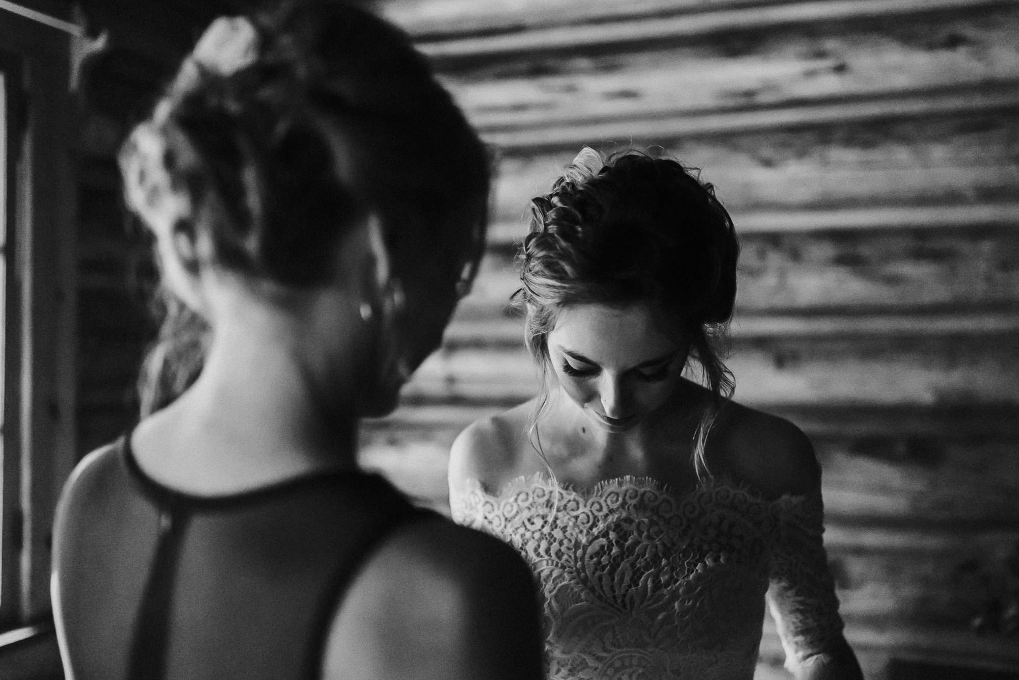 Mother helps bride get ready at Skyliner Lodge