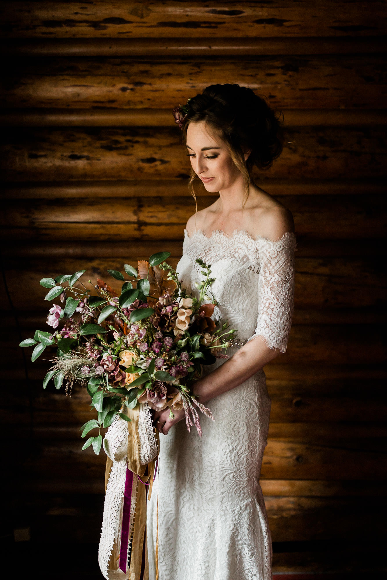 Bride poses with her bouquet in Skyliner Lodge