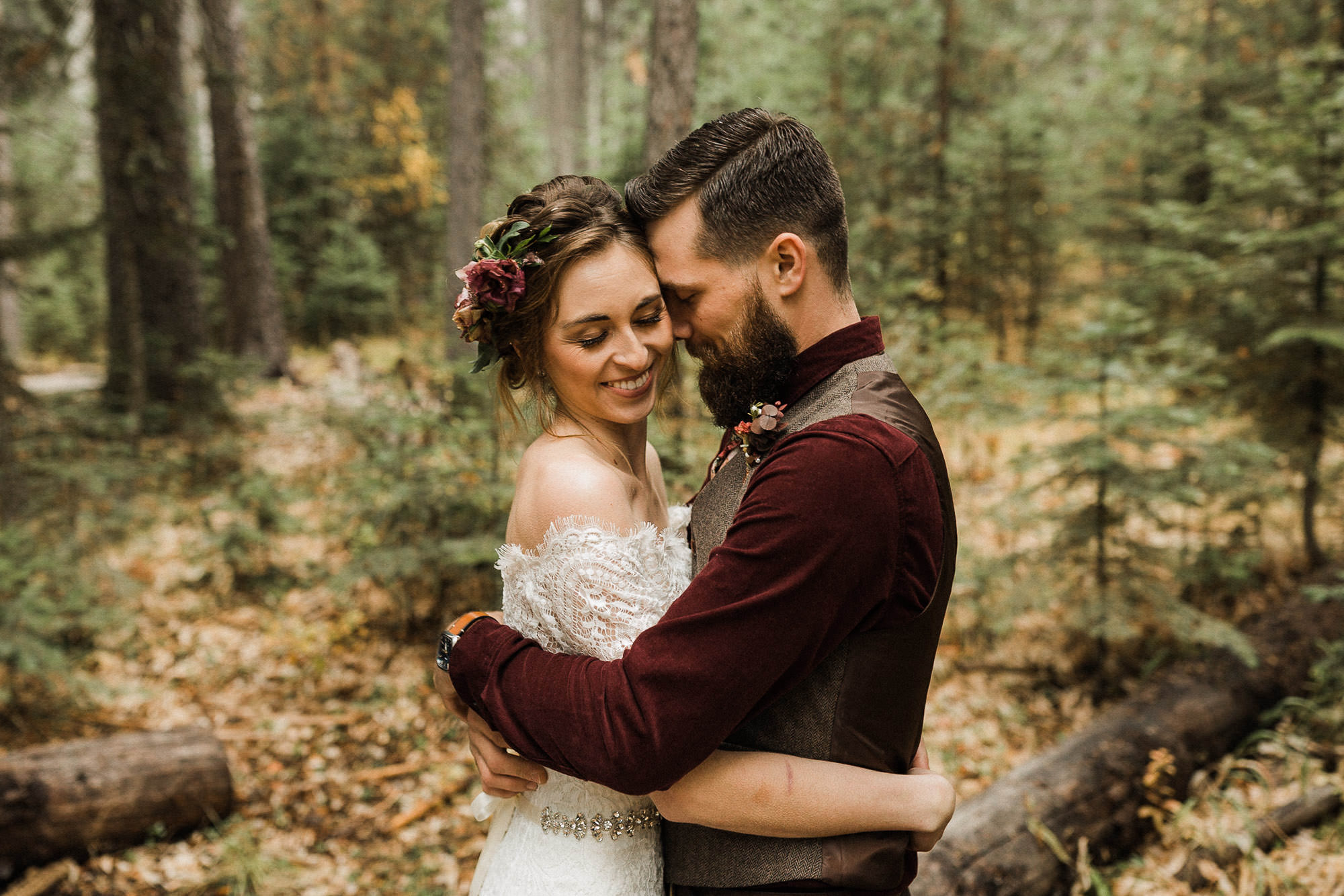 Bride and groom pose in the forest at Skyliner Lodge in Bend