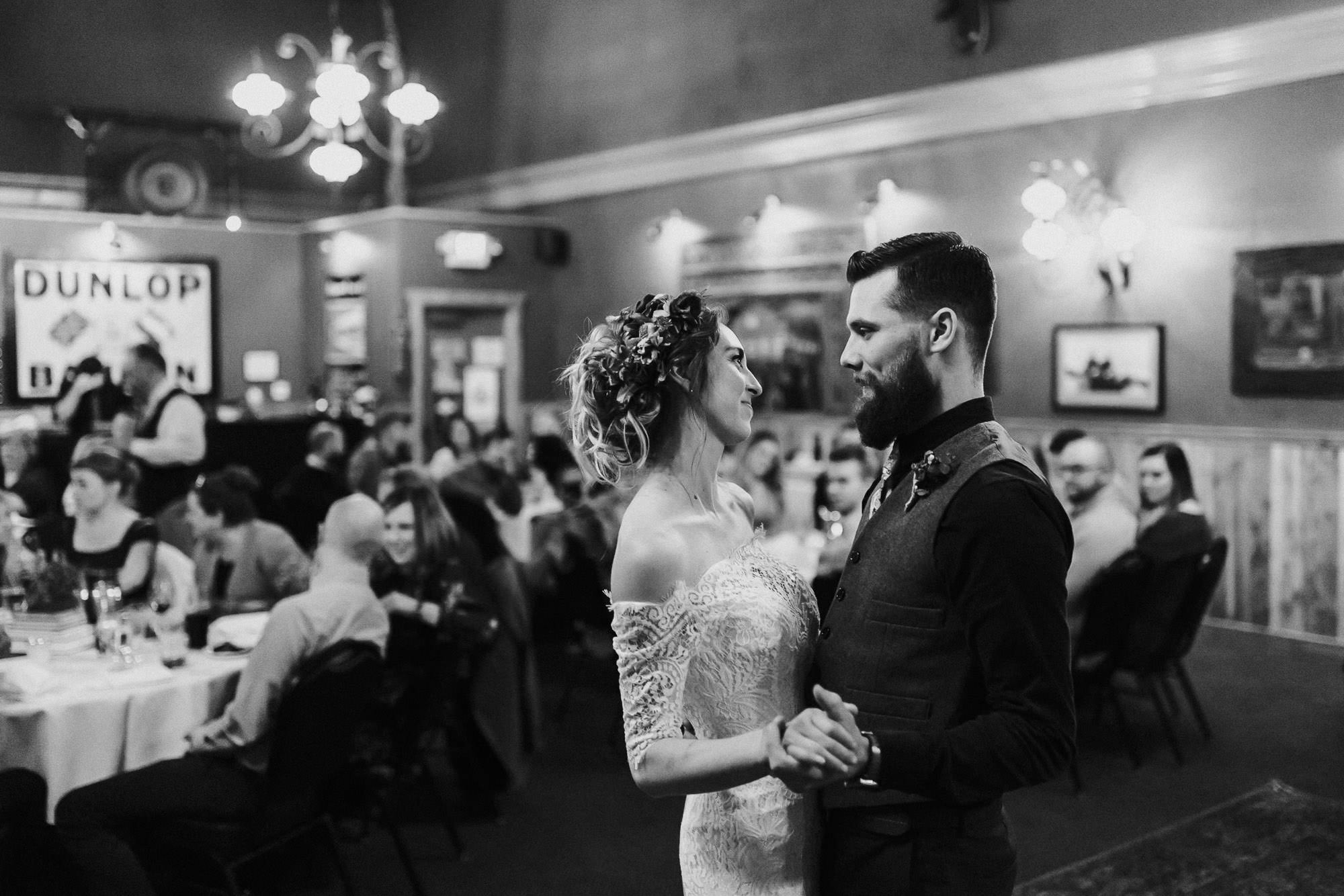 Bride and groom share their first dance in Father Luke's Room at McMenamin's in Bend