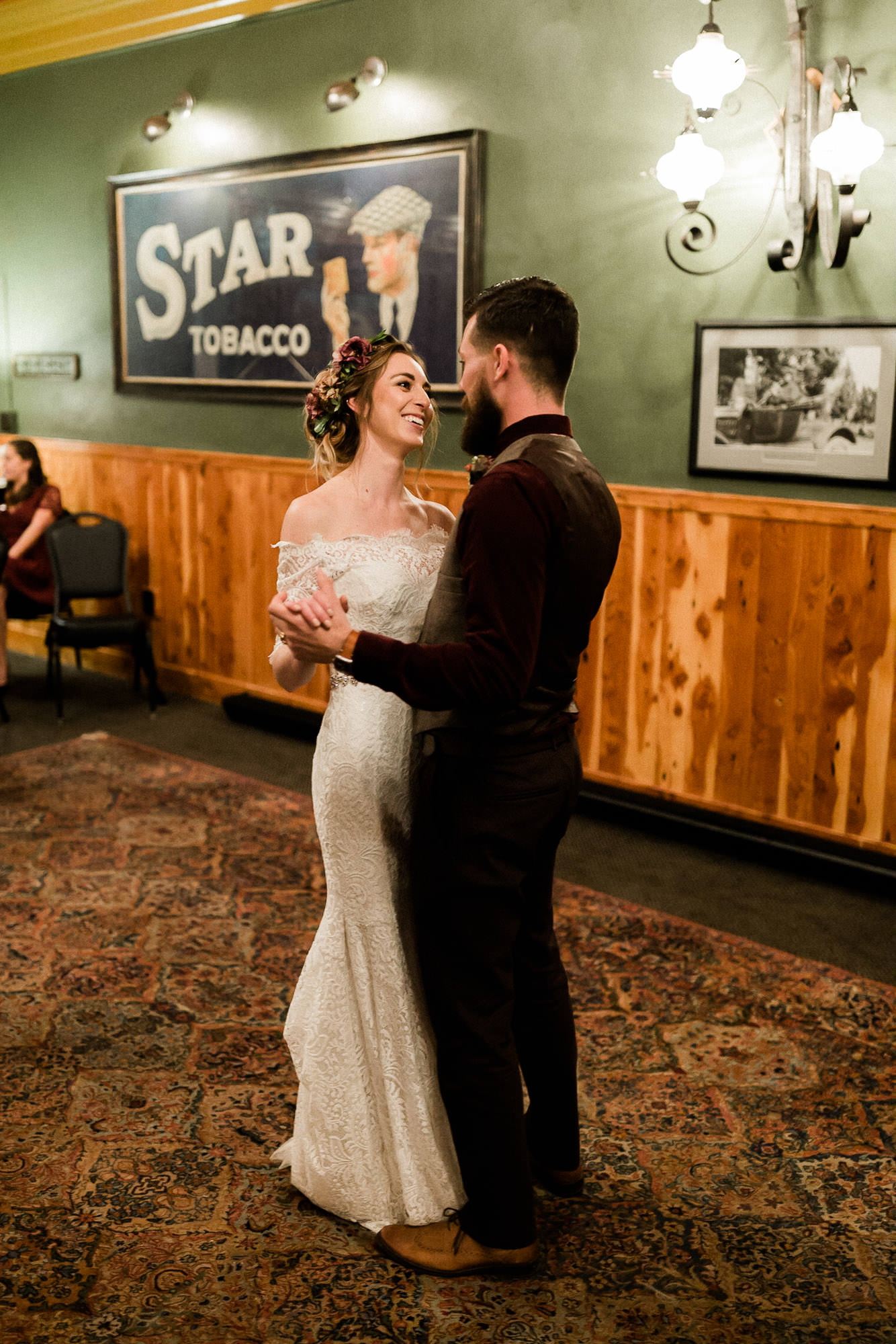 Bride and groom share their first dance in Father Luke's Room at McMenamin's in Bend