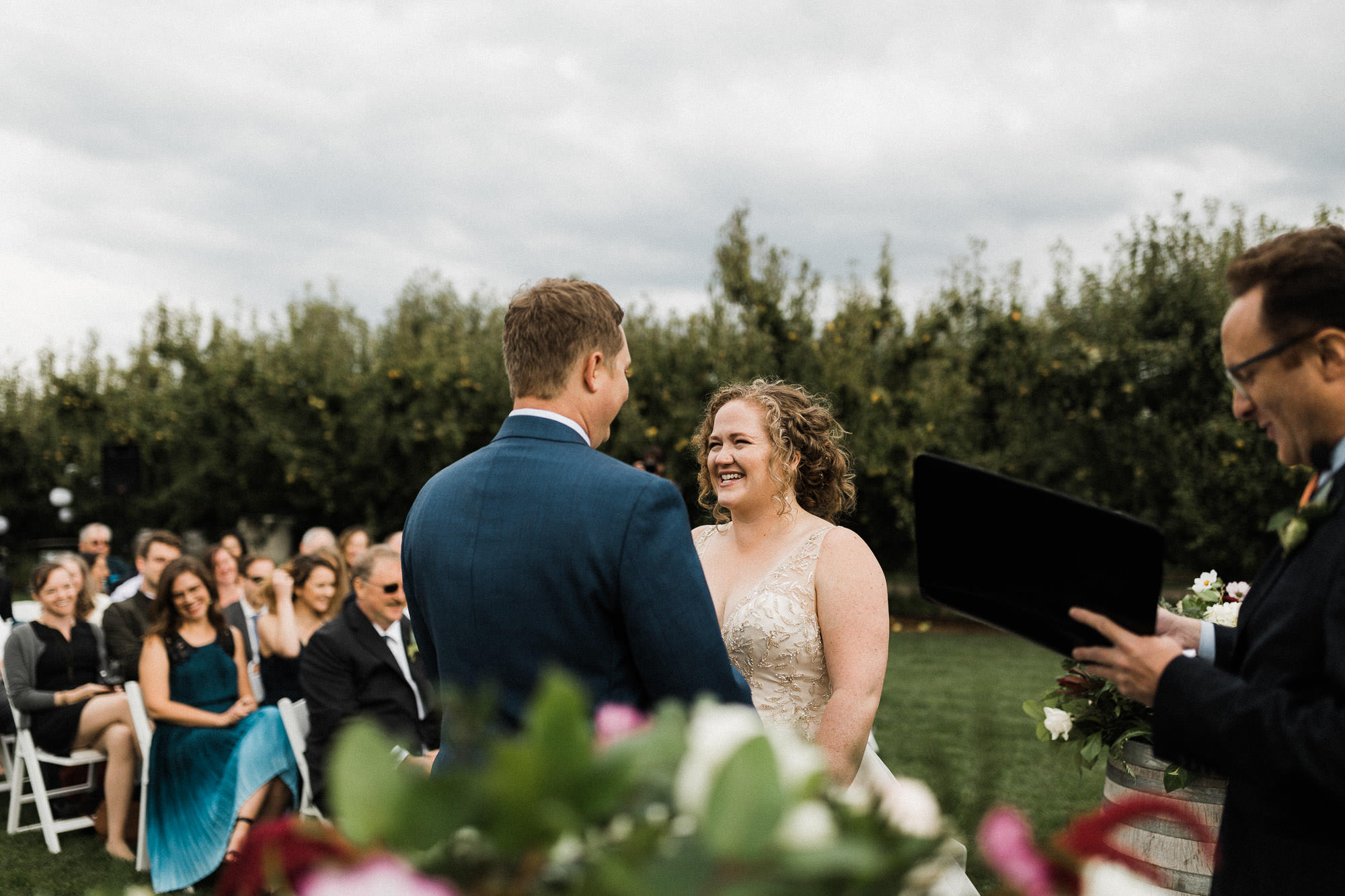 The bride laughs during the ceremony at Mt. View Orchards in Mt Hood, Oregon.