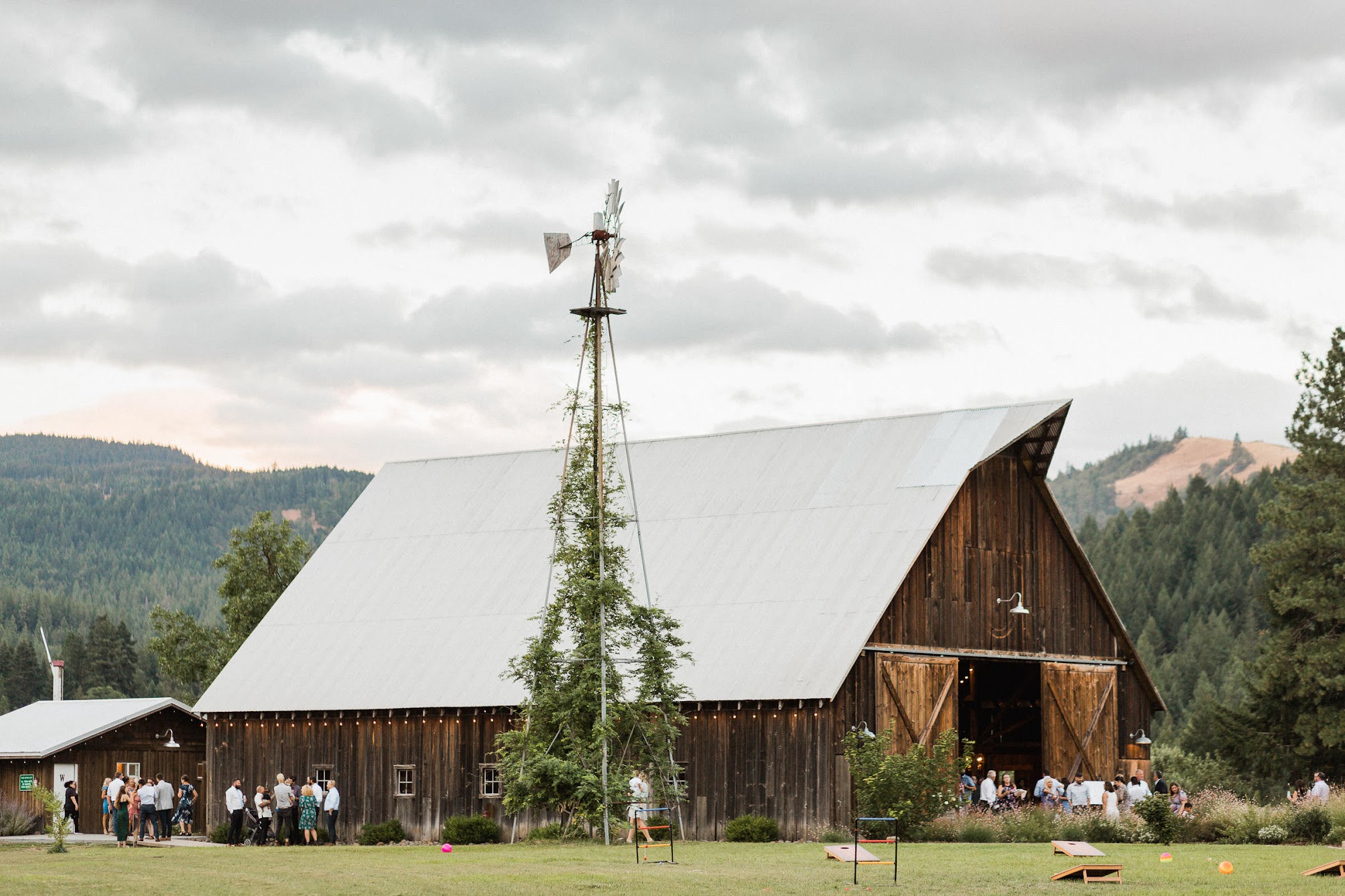 zoomed out photo of a rustic barn set for a wedding reception 