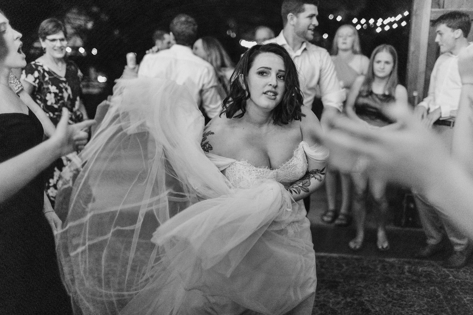 The bride waves her dress around while the night comes to an end.