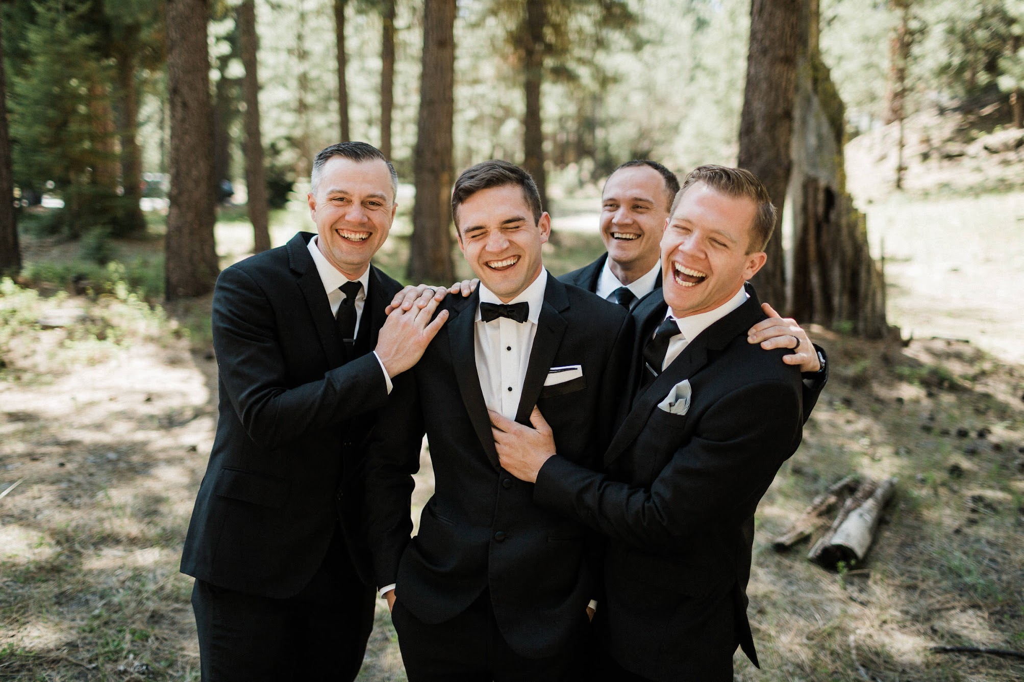 groom and his groomsmen all laughing.