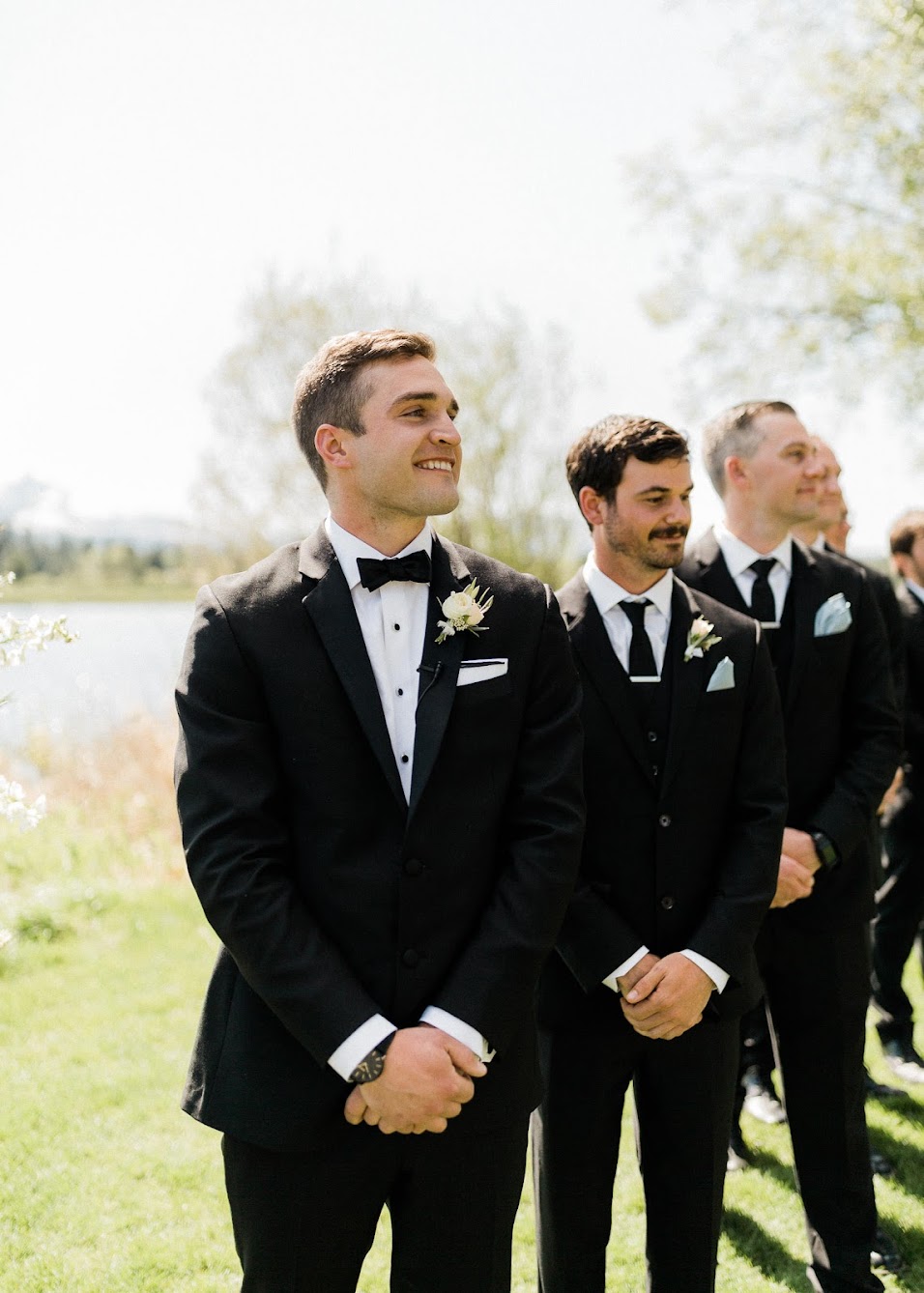 groomsmen standing in line at the ceremony 