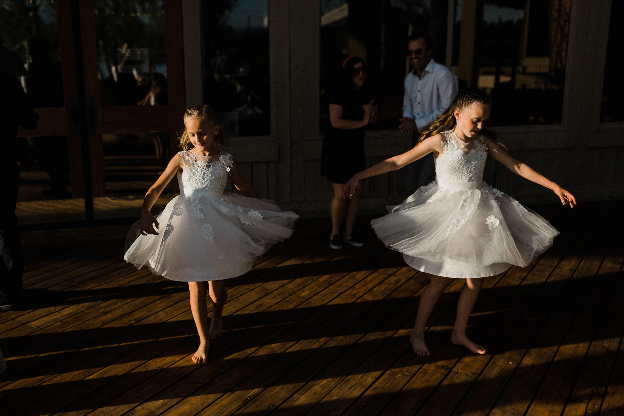 two little girls dancing on the dance floor 