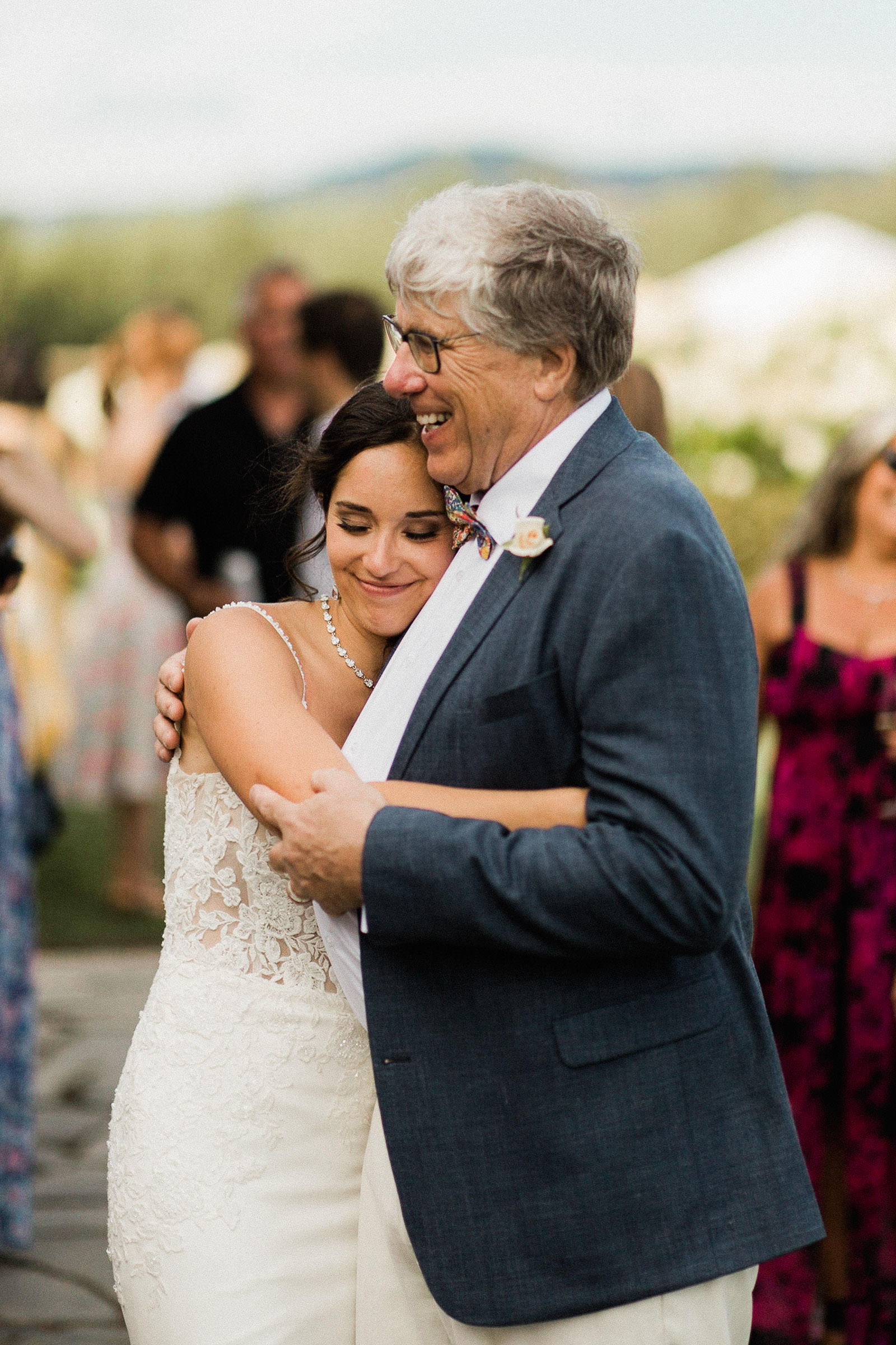 Bride hugs her father 