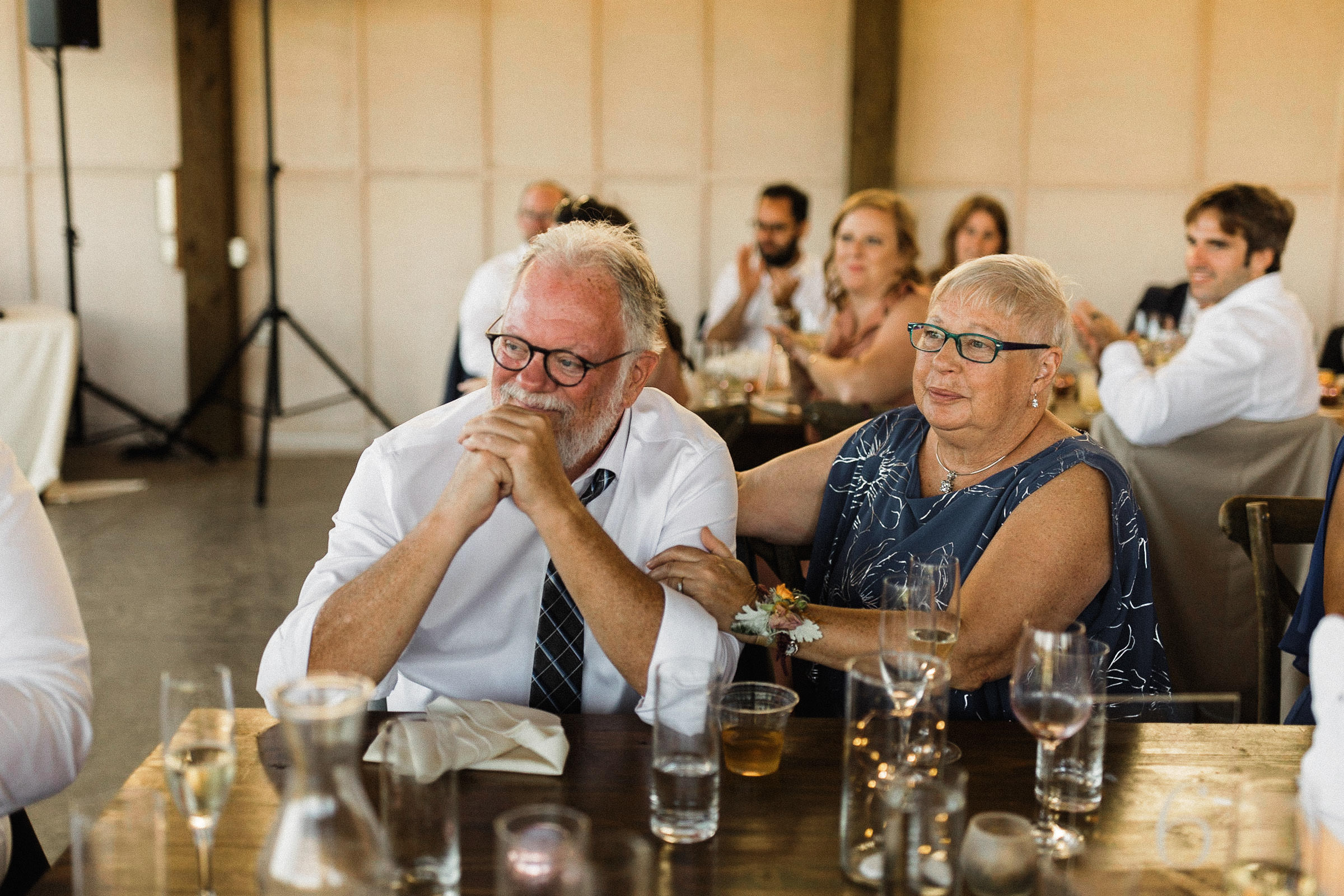 Groom's mother and father react emotionally to a toast