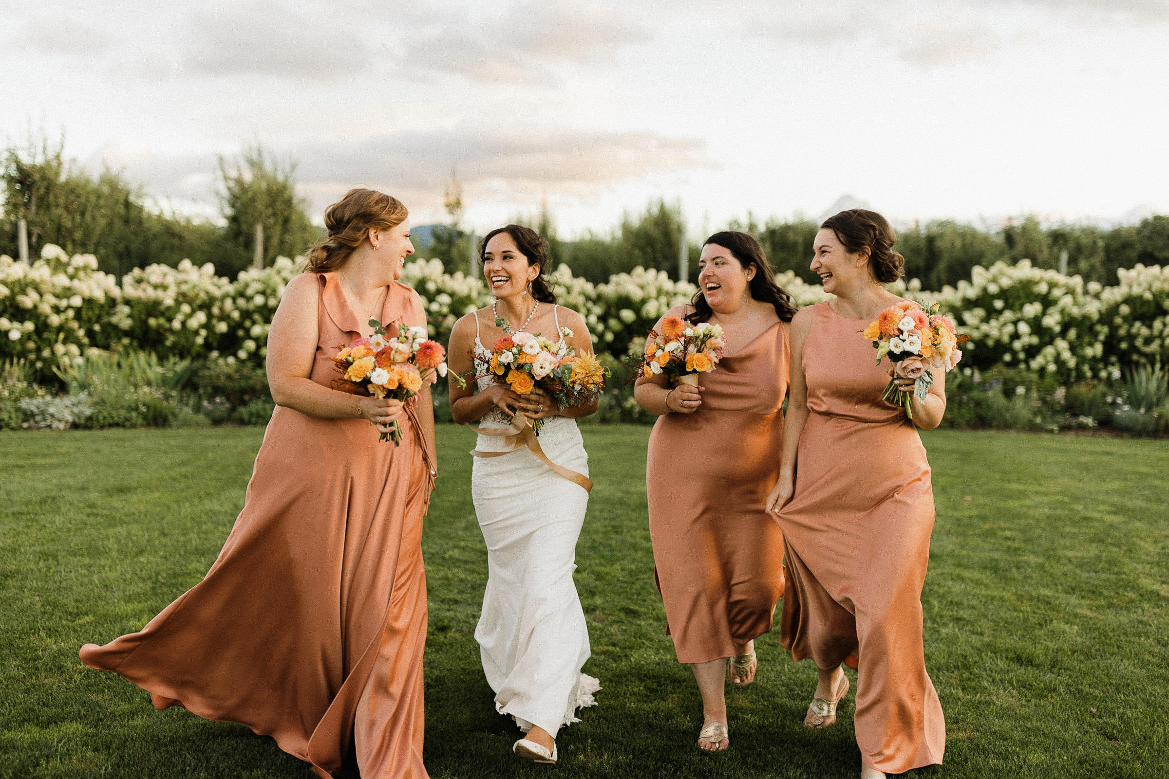 Bridal party walking and laughing