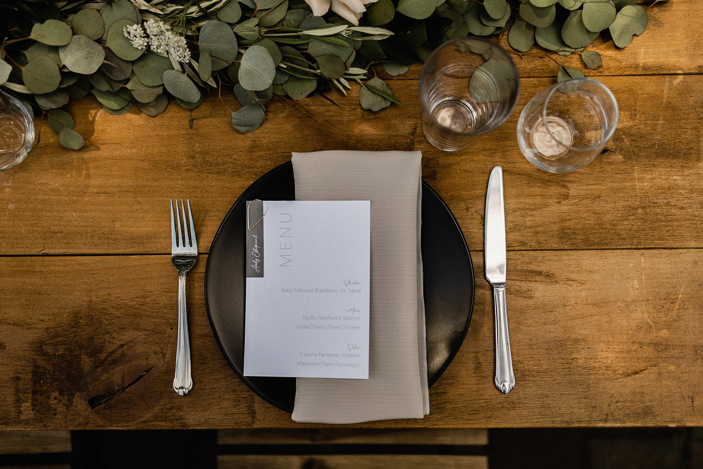A bird's-eye view of a table setting featuring the dinner menu