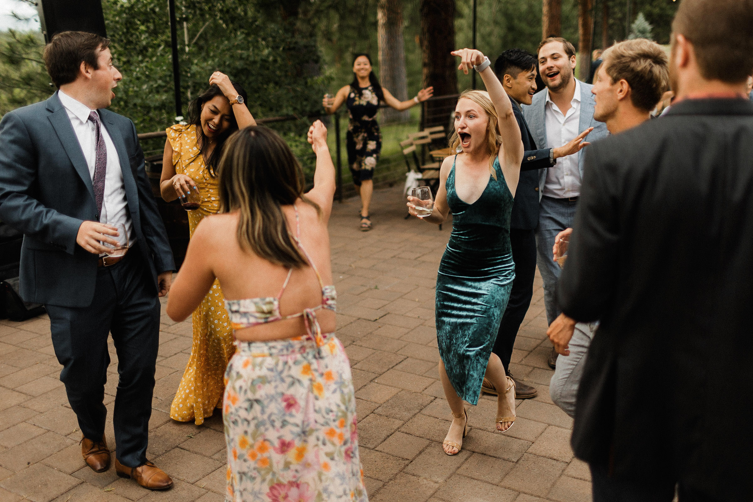 Guests dance during outdoor reception 