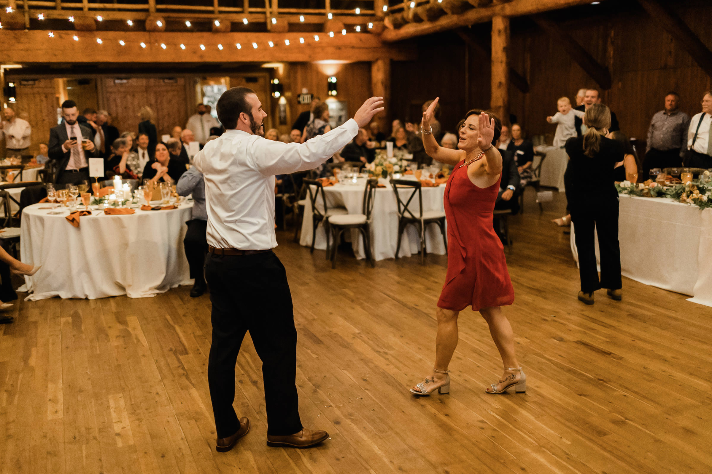 Groom and his mom dance together