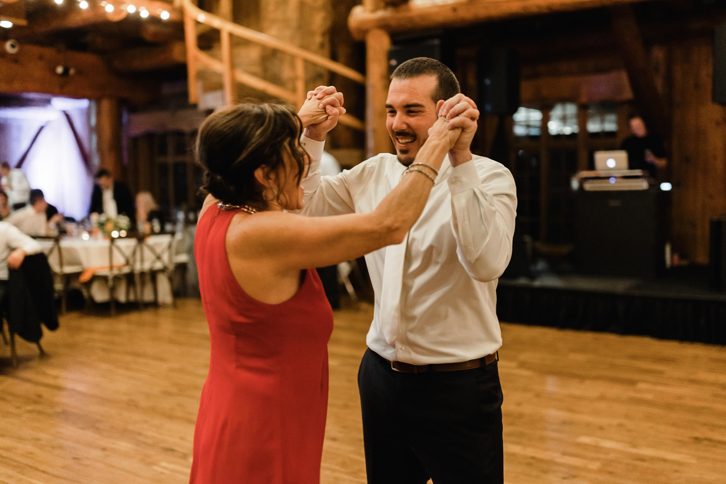 Groom and his mom dance together